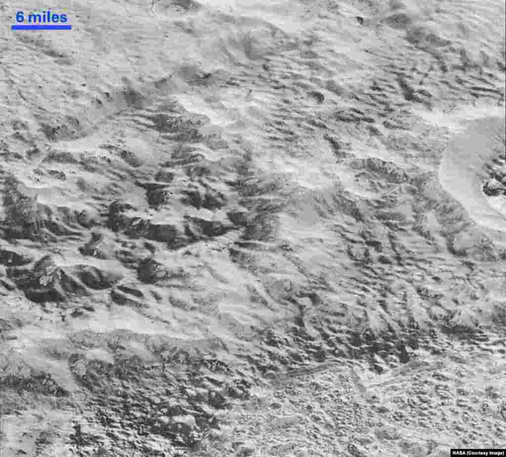 This highest-resolution image from NASA’s New Horizons spacecraft shows how erosion and faulting have sculpted this portion of Pluto’s icy crust into rugged badlands topography, Dec. 4, 2015.