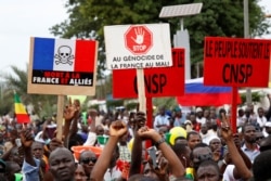 Opposition supporters attend a rally to celebrate the ousting of President Ibrahim Boubacar Keita, at the Independence Square in Bamako, Mali, Aug. 21, 2020.