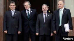 Foreign ministers, Venezuela's Elias Jose Jaua (L-R), Uruguay's Luis Almagro, Brazil's Antonio Patriota and Argentina's Hector Timerman, pose for the media before a Mercosur trade block meeting, in preparation for the group's presidential summit, in Monte