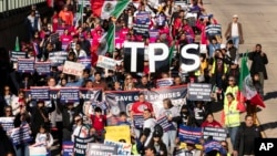 FILE - Immigrants rally for work permits for Deferred Action for Childhood Arrivals and Temporary Protected Status programs in Washington on Nov. 14, 2023. The Department of Homeland Security extended TPS protection for over 800,000 people on Jan. 10, 2025.