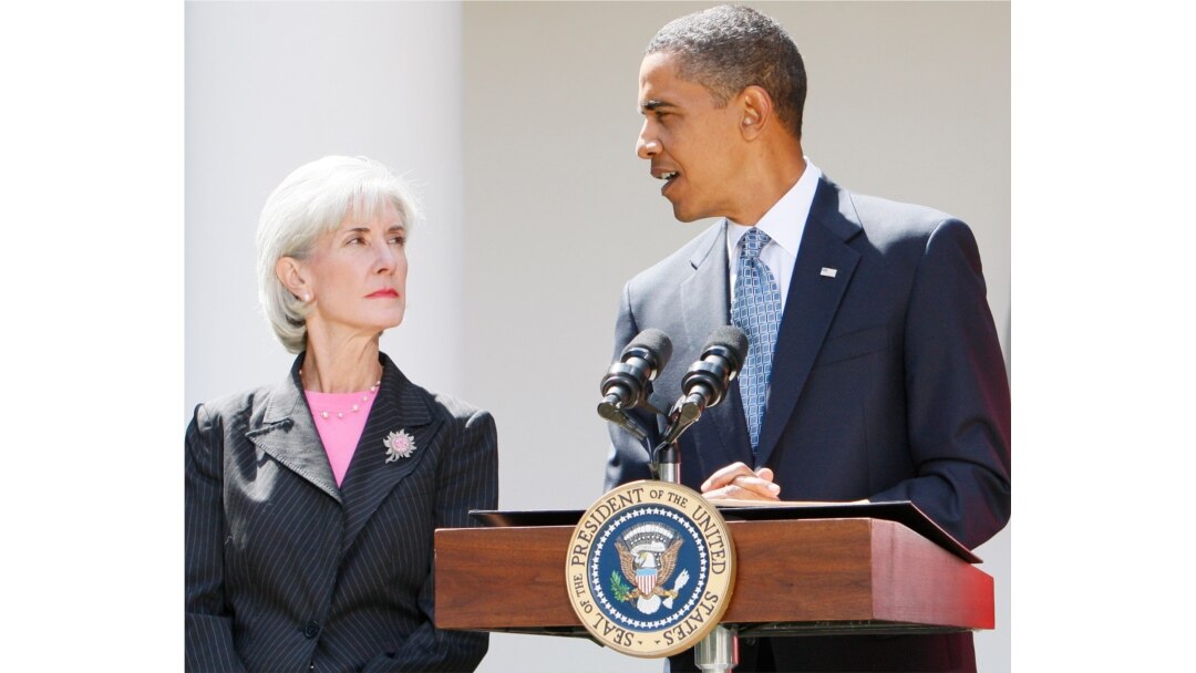 FILE - President Barack Obama stands with Health and Human Services Secretary Kathleen Sebelius as he makes a statement on the H1N1 swine flu virus in the Rose Garden of the White House in Washington, Sept. 1, 2009.