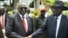 South Sudan's First Vice President Riek Machar, left, and President Salva Kiir, right, shake hands following the first meeting of a new transitional coalition government, in the capital Juba, April 29, 2016. 