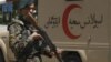 An Afghan soldier patrols outside a hospital in Kabul