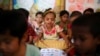 FILE - Rohingya refugee children attend a class to learn Burmese language at a refugee camp in Cox's Bazar, Bangladesh, April 9, 2019.