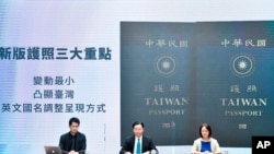 In this Sept. 2, 2020, photo released by the Executive Yuan, Taiwan's Foreign Minister Joseph Wu (C) and Executive Yuan spokesperson Evian Ting (L), and Director of Consular Affairs Bureau Phoebe Yeh unveil Taiwan's new passport cover in Taipei.