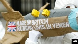 FILE - Amnesty International members protest by carrying a mock up of a missile, against the British Governments continued sale of arms to Saudi Arabia outside Downing Street in London, March 18, 2016.