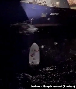 The Greek Navy conducts a rescue operation after a migrant boat capsized off the island of Gavdos, Greece, Dec. 14, 2024, in this still image obtained from a video.