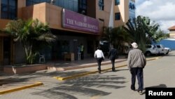 Patients walk into the Nairobi Hospital during a strike by government doctors to demand the fulfilment of a 2013 agreement between their union and the government that would raise their pay and improve working conditions, Feb. 15, 2017. 