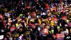 Participants stage a rally to demand South Korean President Yoon Suk Yeol's impeachment, outside the National Assembly in Seoul, South Korea, Dec. 13, 2024.