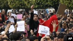 Protesters shout slogans during a demonstration in Tunis, Jan. 19. 2011.