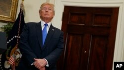 President Donald Trump listens in the Roosevelt Room of the White House in Washington, Aug. 2, 2017.