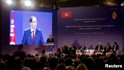 FILE - Tunisia's Prime Minister Youssef Chahed speaks during a national conference on the country's 2019 budget in Tunis, Tunisia, Sept. 14, 2018.