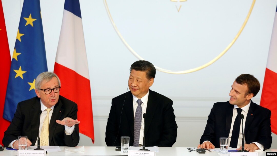 French President Emmanuel Macron, his Chinese counterpart Xi Jinping and European Commission President Jean-Claude Juncker hold a news conference with German Chancellor Angela Merkel at the Elysee presidential palace in Paris, France, March 26, 2019.
