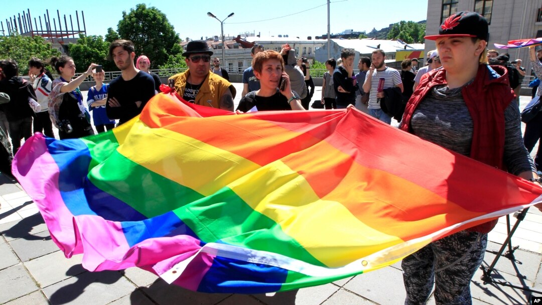 Georgian LGBT activists attend a rally against homophobia outside the State Chancellery to mark international day against homophobia in Tbilisi, Georgia. 
