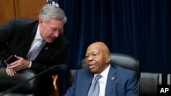 House Oversight Committee Chairman Elijah Cummings, D-Md., center, has a word with Rep. Mark Meadows, R-N.C., just after the panel voted 24-15 to hold Attorney General William Barr and Commerce Secretary Wilbur Ross in contempt, on Capitol Hill in Washington, June 12, 2019.