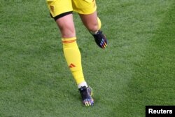 November 23, 2022 General view of Germany's Manuel Neuer rainbow themed boots REUTERS/Molly Darlington.