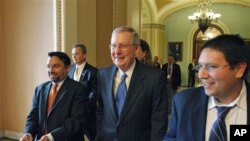 Senate Minority Leader Mitch McConnell, R-Ky., center, on Capitol Hill in Washington, 15 Nov 2010