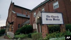FILE - The Church Brew Works, a brewery operating in a renovated church, stands in Pittsburgh, Aug. 7, 2017. At the Church Brew Works, an early church-turned-brewery that opened in 1996, patrons slide into booths crafted from pews. Breweries opening in renovated churches are winning fans but earning disapproval from clergy and worshippers across the U.S. 