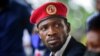 Presidential challenger Bobi Wine speaks to the media outside his home, in Magere, near Kampala, Uganda, Jan. 26, 2021. 