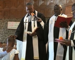 Clergy is seen at the Catholic Church Bamenda in Bamenda, northwestern Cameroon, Dec. 25, 2019. (Moki Edwin Kindzeka/VOA)