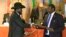 Days after signing a power-sharing deal with South Sudan President Salva Kiir (left), rebel chief Riek Machar (right) says there is still "a long way to go" before peace is restored.
