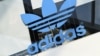 FILE - The Adidas logo is pictured during celebrations for German sports apparel maker Adidas' 70th anniversary at the company's headquarters in Herzogenaurach, Germany, August 9, 2019.