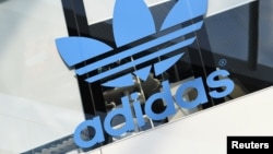 FILE - The Adidas logo is pictured during celebrations for German sports apparel maker Adidas' 70th anniversary at the company's headquarters in Herzogenaurach, Germany, August 9, 2019.