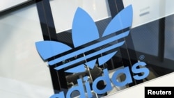 FILE - The Adidas logo is pictured during celebrations for German sports apparel maker Adidas' 70th anniversary at the company's headquarters in Herzogenaurach, Germany, August 9, 2019.