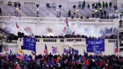 FILE - In this Jan. 6, 2021, file photo, violent protesters, loyal to then-President Donald Trump, storm the Capitol, Wednesday, Jan. 6, 2021, in Washington. A Drug Enforcement Administration agent arrested on charges stemming from the Jan. 6 riot at…