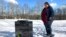 FILE: Deb Walker, of Chester, Vt., visits the grave of daughter Brooke Goodwin on Dec. 9, 2021. Goodwin, 23, died in March of 2021 of a fatal overdose of the powerful opioid fentanyl and xylazine, an animal tranquilizer that is making its way into the illicit drug supply.