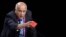 Palestinian football chief Jibril Rajoub shows a red card as he speaks during a FIFA Congress in Zurich, Switzerland, May 29, 2015.