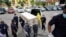 Temple workers carry a coffin containing a body of a man who died from the coronavirus disease (COVID-19) during his funeral at a temple in Bangkok, Thailand, April 24, 2021.