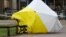 The forensic tent, covering the bench where Sergei Skripal and his daughter Yulia were found, is blown out of position in the centre of Salisbury, Britain, March 8, 2018