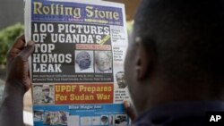 A Ugandan man reads the headline of the Ugandan newspaper 'Rolling Stone' in Kampala, Uganda, 19 Oct 2010