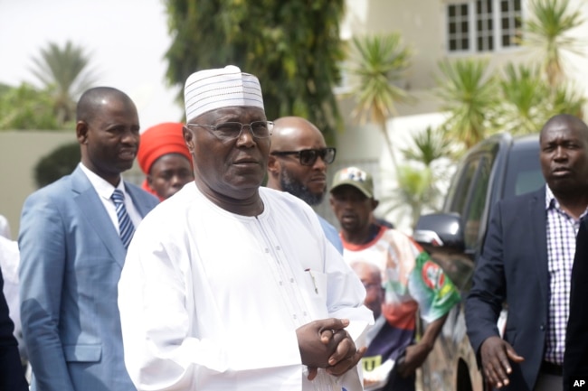 FILE - Nigerian presidential candidate Atiku Abubakar of the People's Democratic Party, speaks to journalists at his residence in Yola, Nigeria, Feb. 16, 2019.
