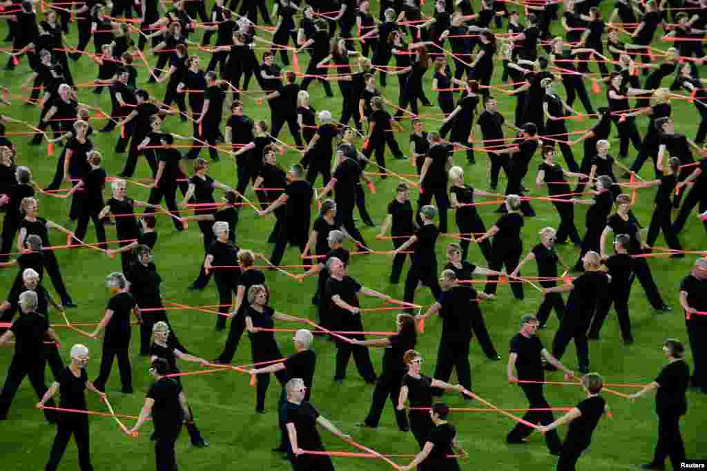 Switzerland&#39;s performance &quot;Let&#39;s Move Together&quot; is seen at the Gymnaestrada&#39;s Midnight Sun Special at the Olympic stadium in Helsinki, Finland, July 15, 2015.