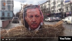 In this screen grab Friday, activists in Simferopol, a city annexed along with the Crimean peninsula, burned an effigy of Turkish President Recept Tayyip Erdogan.
