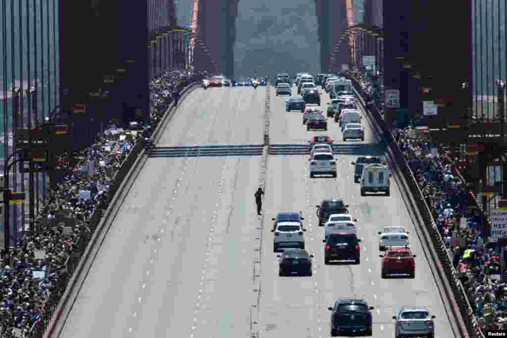 Thousands of demonstrators march across the Golden Gate Bridge during a protest against racial inequality in San Francisco, California, June 6, 2020.