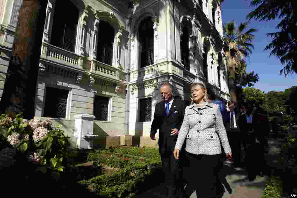 U.S. Secretary of State Hillary Clinton and Organization of the Islamic Conference (OIC) Secretary General Ekmeleddin Ihsanoglu (L) chat as they walk before their meeting in Istanbul July 15, 2011. Western and Arab powers began talks in Turkey on Friday a