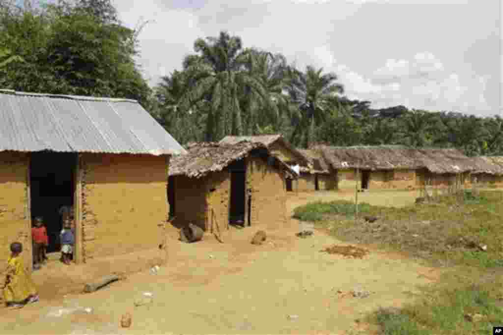 Children stand at there house outside the small village of Walikale, Congo, Thursday, Sept. 16, 2010. Hundreds of woman and children have been victims of rape and murder in Congo, by rebel troops. (AP Photo/Schalk van Zuydam)