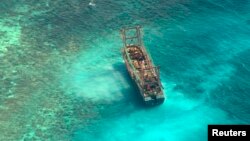 A Chinese fishing vessel that ran aground in Tubbataha Reef, a UNESCO World Heritage site, on Monday is pictured in Palawan Province, west of Manila, April 10, 2013.