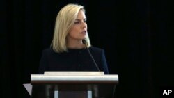 U.S. Department of Homeland Security Secretary Kirstjen Nielsen addresses a convention of state secretaries of state, July 14, 2018, in Philadelphia. Nielsen told the gathering that there are no signs that Russia is targeting this year's midterm elections with the same "scale or scope" it targeted the 2016 presidential election.