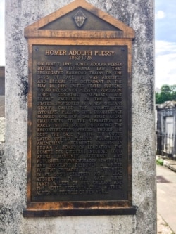 FILE - This June 3, 2018, photo shows a marker on the burial site for Homer Plessy at St. Louis No. 1 Cemetery in New Orleans.