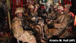 In this file photo, U.S. Army soldiers from the 101st Airborne Division are transported home to Fort Campbell, Ky., May 21, 2013.