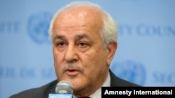 FILE - Palestinian Ambassador Riyad Mansour speaks at U.N. headquarters, July 28, 2014. Mansour on Wednesday accused Israel of continuing to break international law as it builds settlements in occupied territory. 