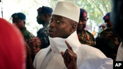 FILE - Gambia's president Yahya Jammeh gestures before voting in Banjul, Gambia, Dec. 1, 2016. Authorities in Gambia have shut down a private radio station, amid rising political tension as Jammeh continues to deny his defeat in recent elections.