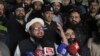 FILE - Hafiz Muhammad Saeed, leader of the Jamaat-ud-Dawa group, or JUD, addresses his supporters in Lahore, Pakistan, Jan. 30, 2017.