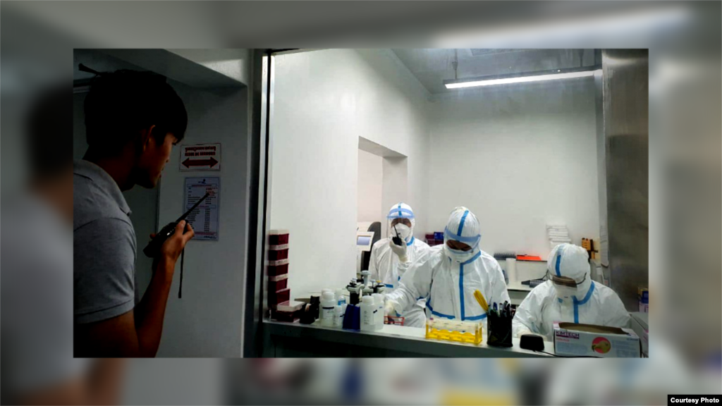 A group of Cambodian medical personnel dressed in protective gears as they performed coronavirus testing. (Courtesy of Cambodia&#39;s Communicable Disease Control Department)