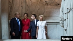 U.S. President Donald Trump and first lady Melania Trump, French President Emmanuel Macron, and his wife Brigitte Macron tour Napoleon Bonaparte’s Tomb at Les Invalides in Paris, France, July 13, 2017.