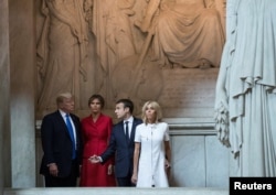 U.S. President Donald Trump and first lady Melania Trump, French President Emmanuel Macron, and his wife Brigitte Macron tour Napoleon Bonaparte’s Tomb at Les Invalides in Paris, France, July 13, 2017.